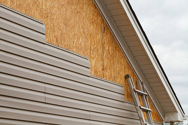 Professional Vinyl Siding technician working in Munson, PA